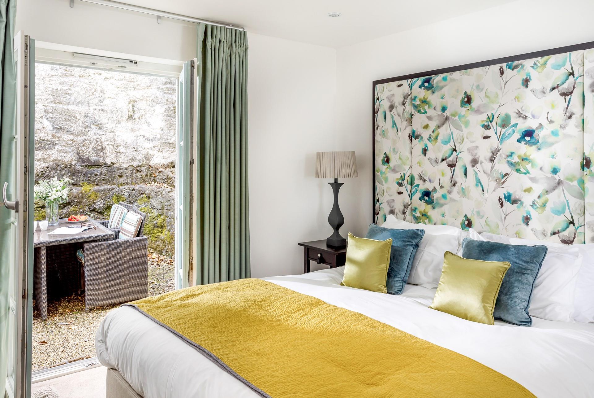 Bedroom 1 has a sumptuous king size bed with a stunning bespoke headboard.