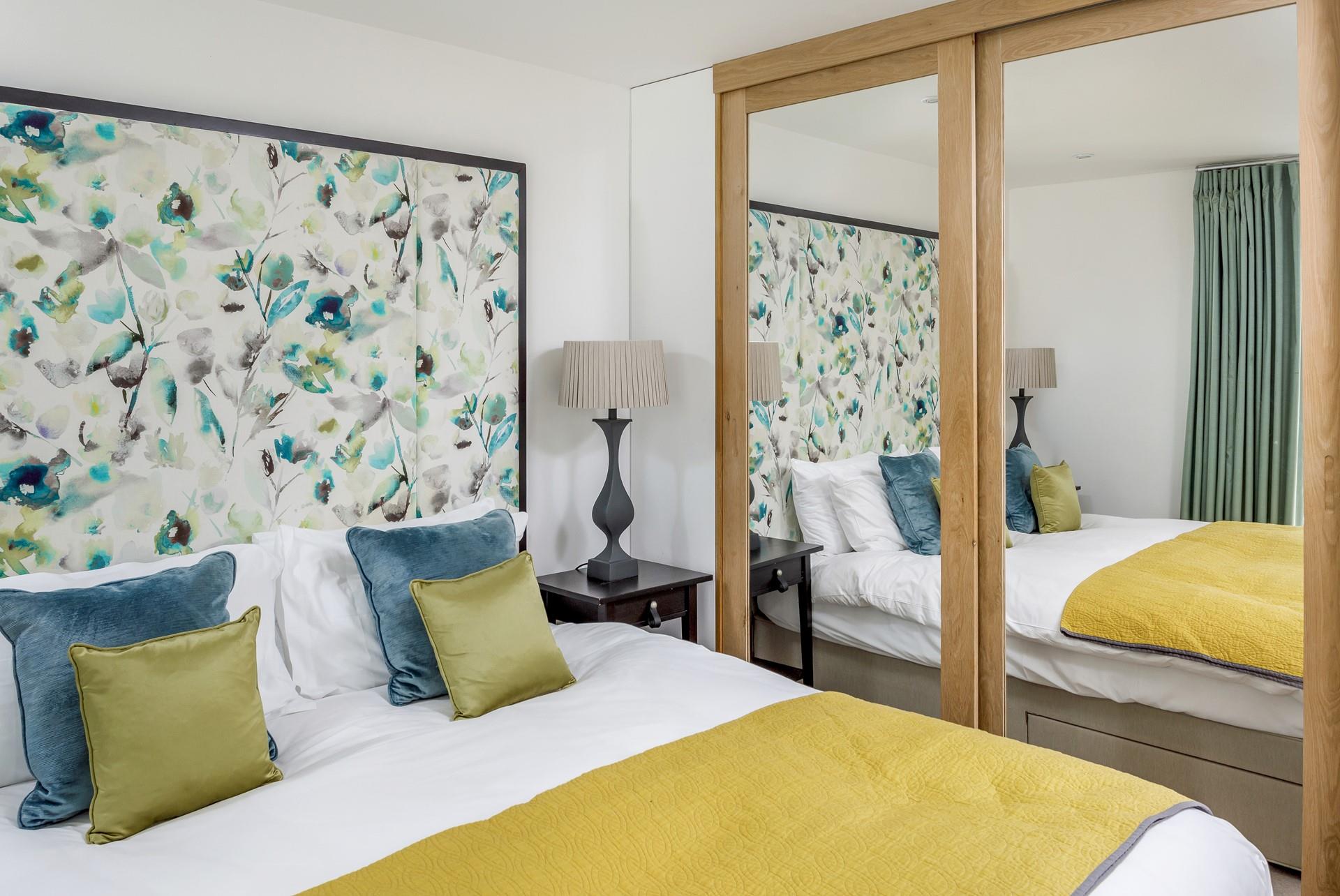 The bedroom is decorated with luxury touches and stylish decor.