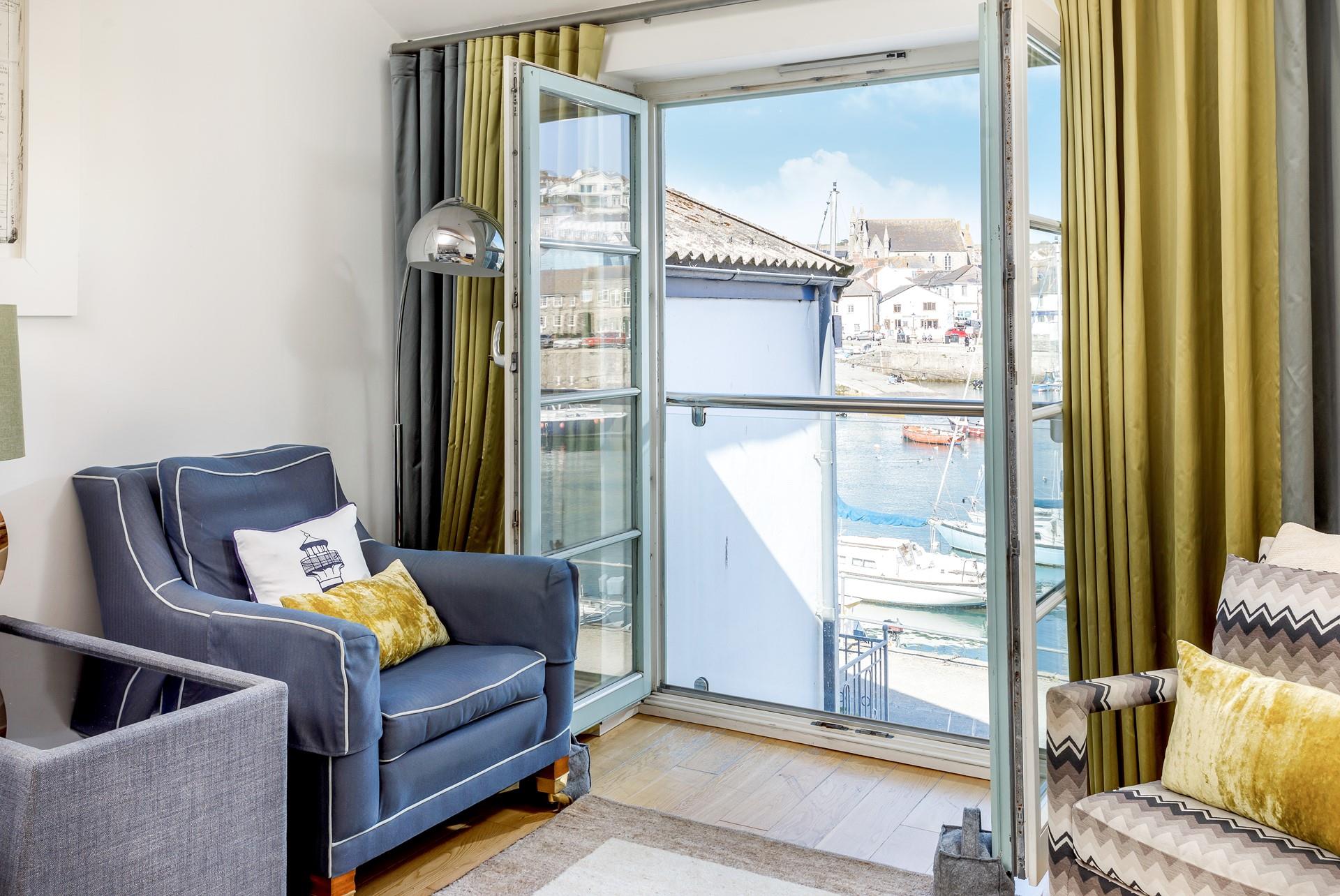 Sit in the window and watch the boats bobbing in the harbour.