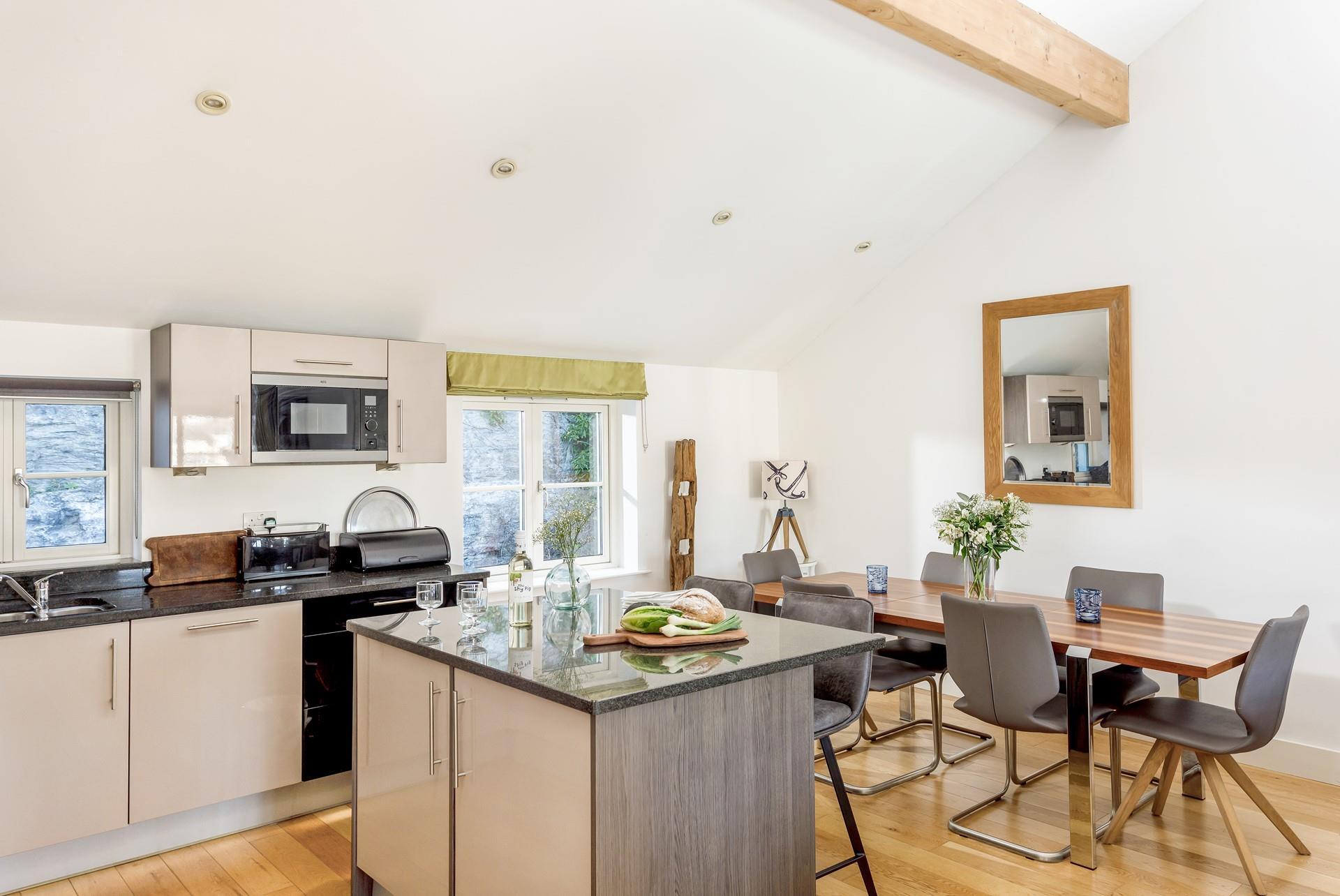 Sit around the sleek dining table and tuck into a family feast.