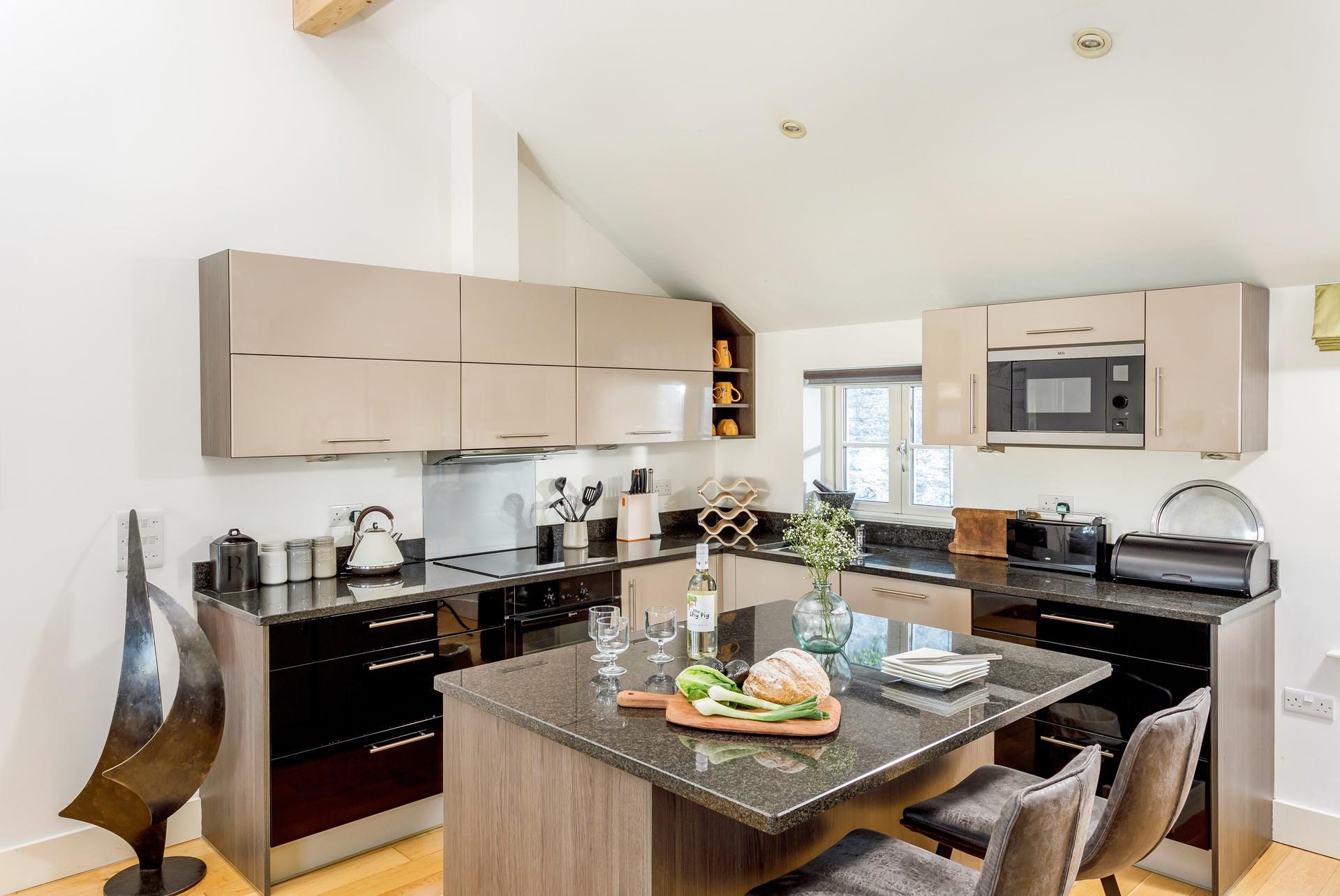 The kitchen is modern and well-equipped for cooking up a storm.