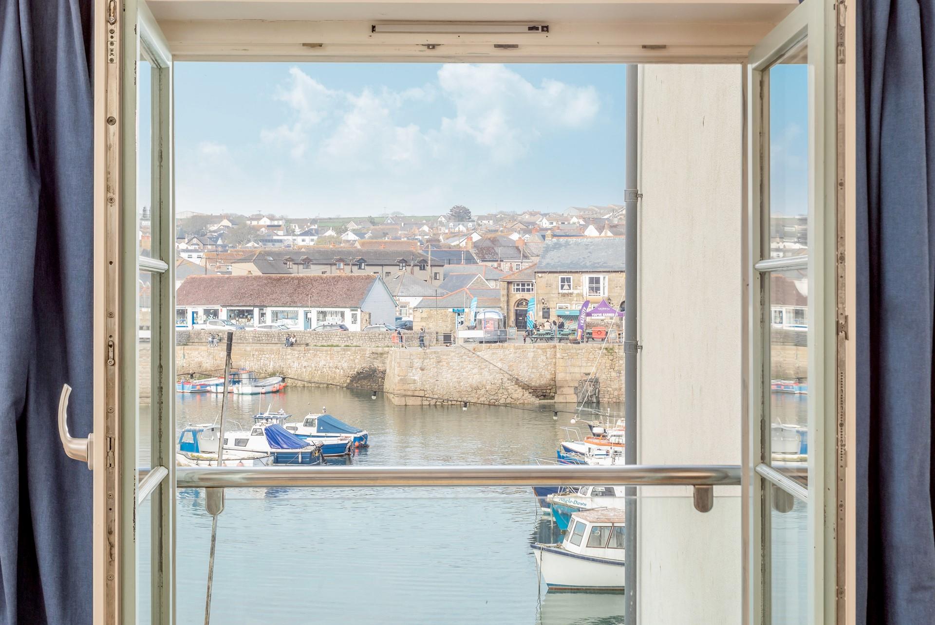 Watch the hustle and bustle of the village from the comfort of the sitting room.