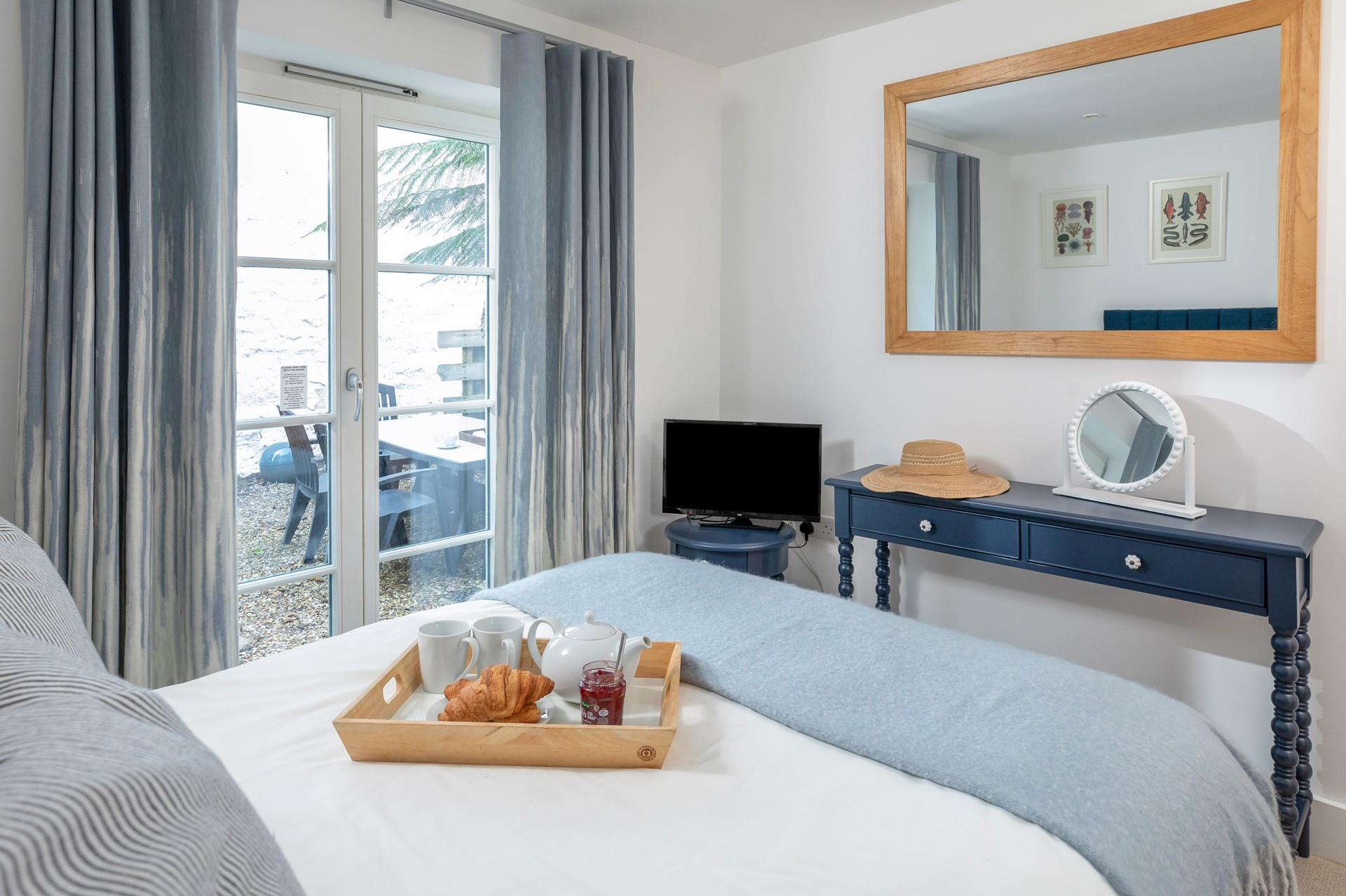 Light blue tones create a calming feel to the bedroom.
