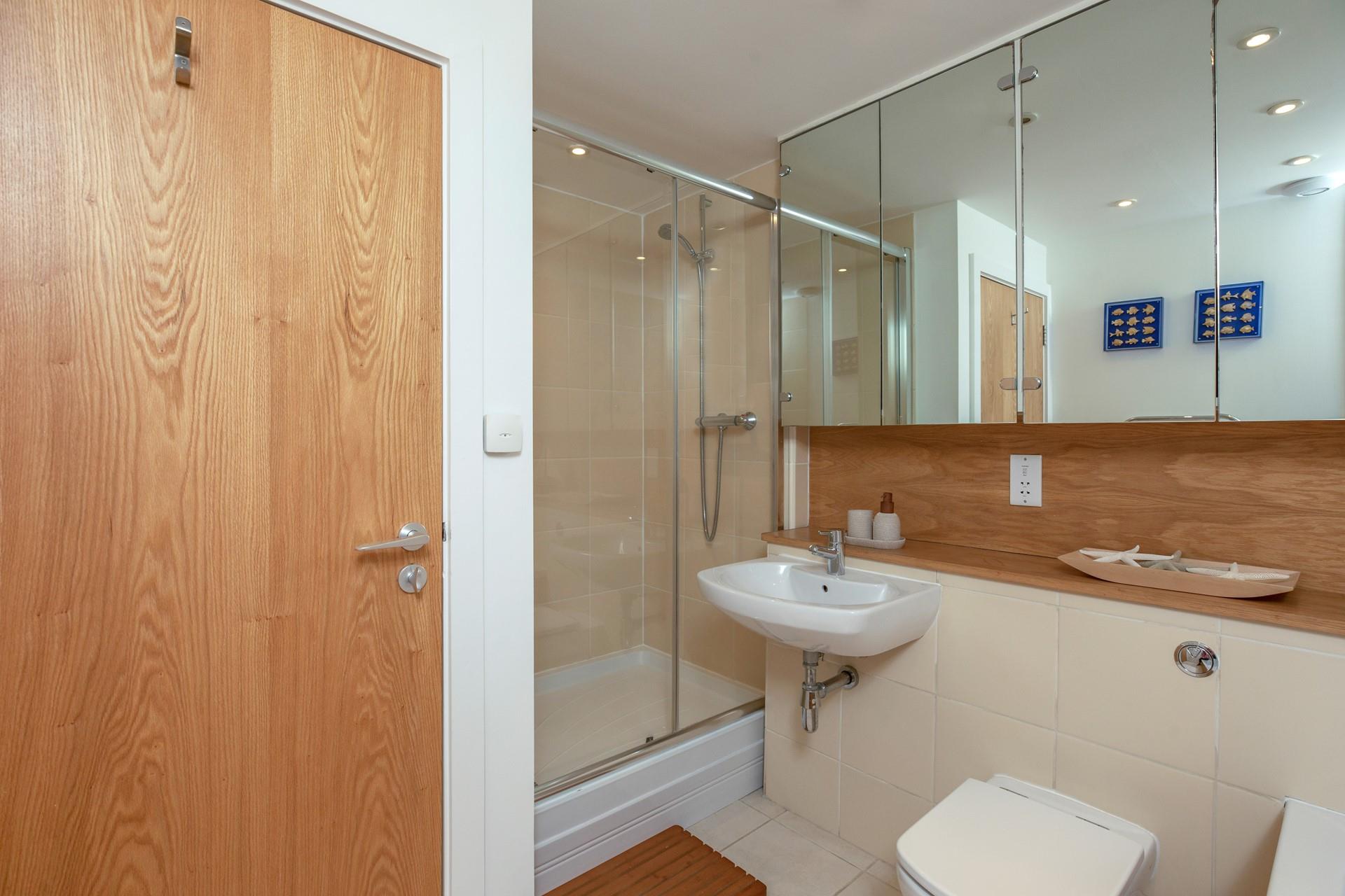 Wash off your sandy toes in the shower after a day on the beach.