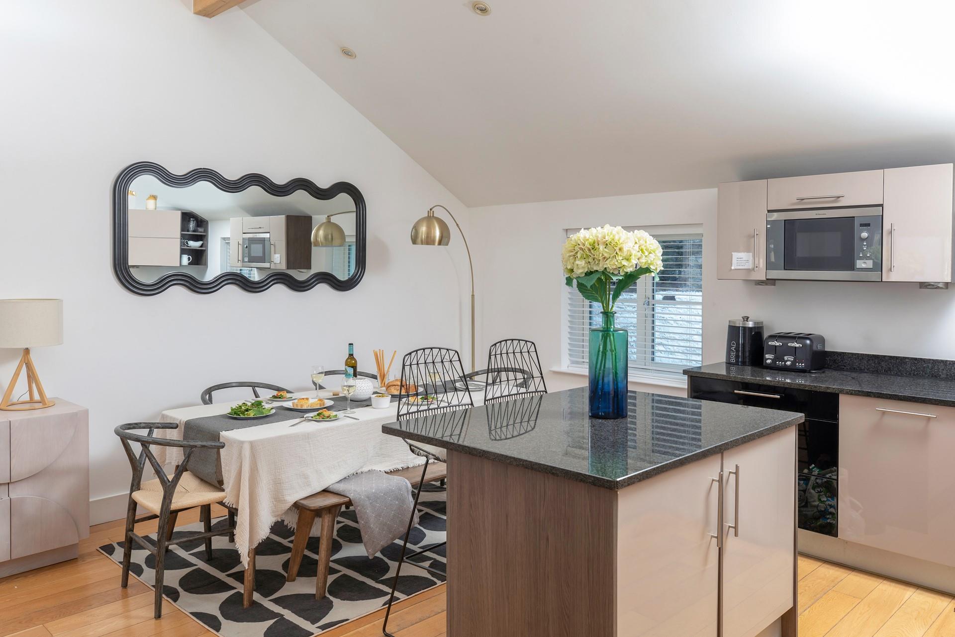 The kitchen is modern and sleek and great for cooking tasty meals.