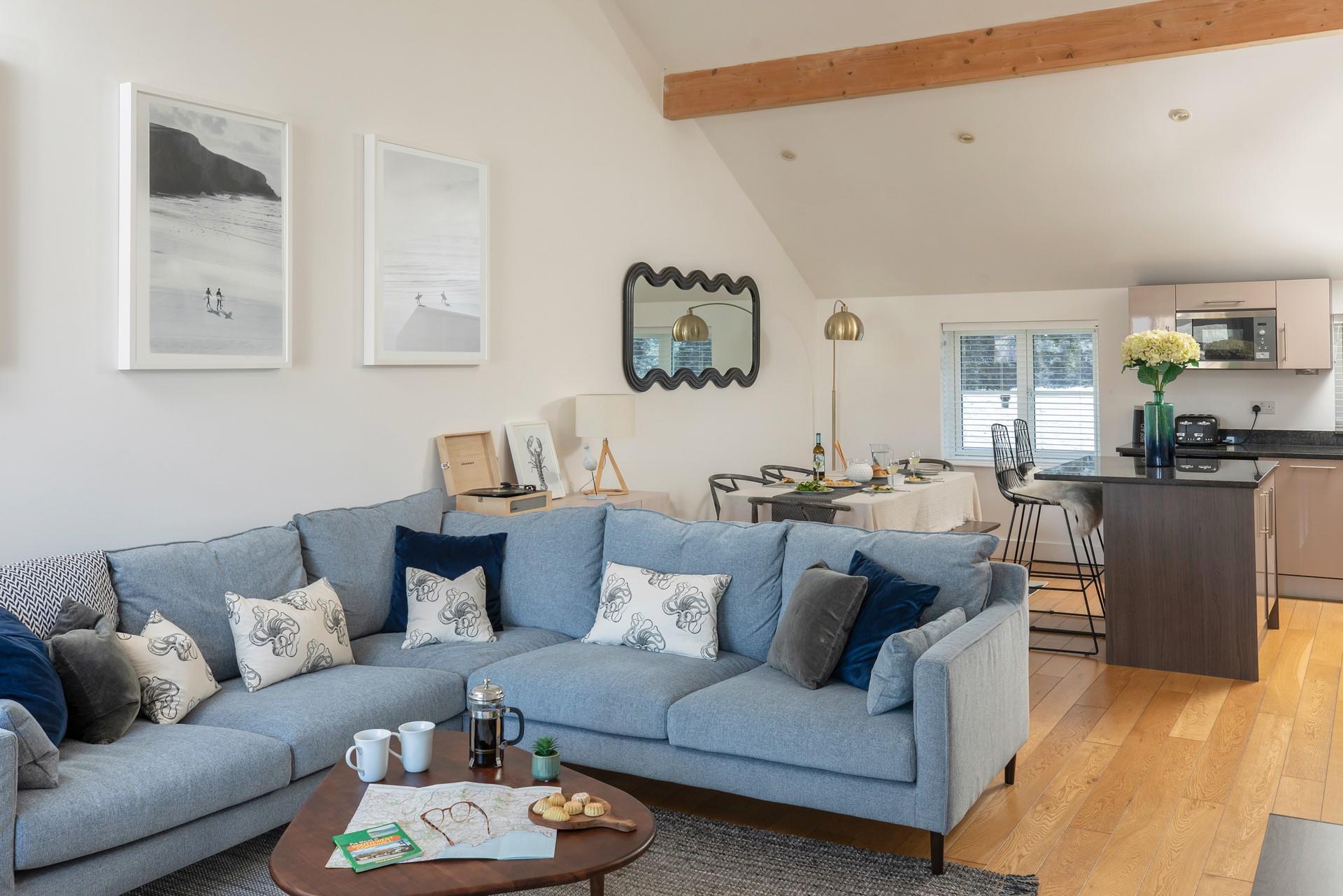 The sitting room is stylishly decorated with coastal tones.