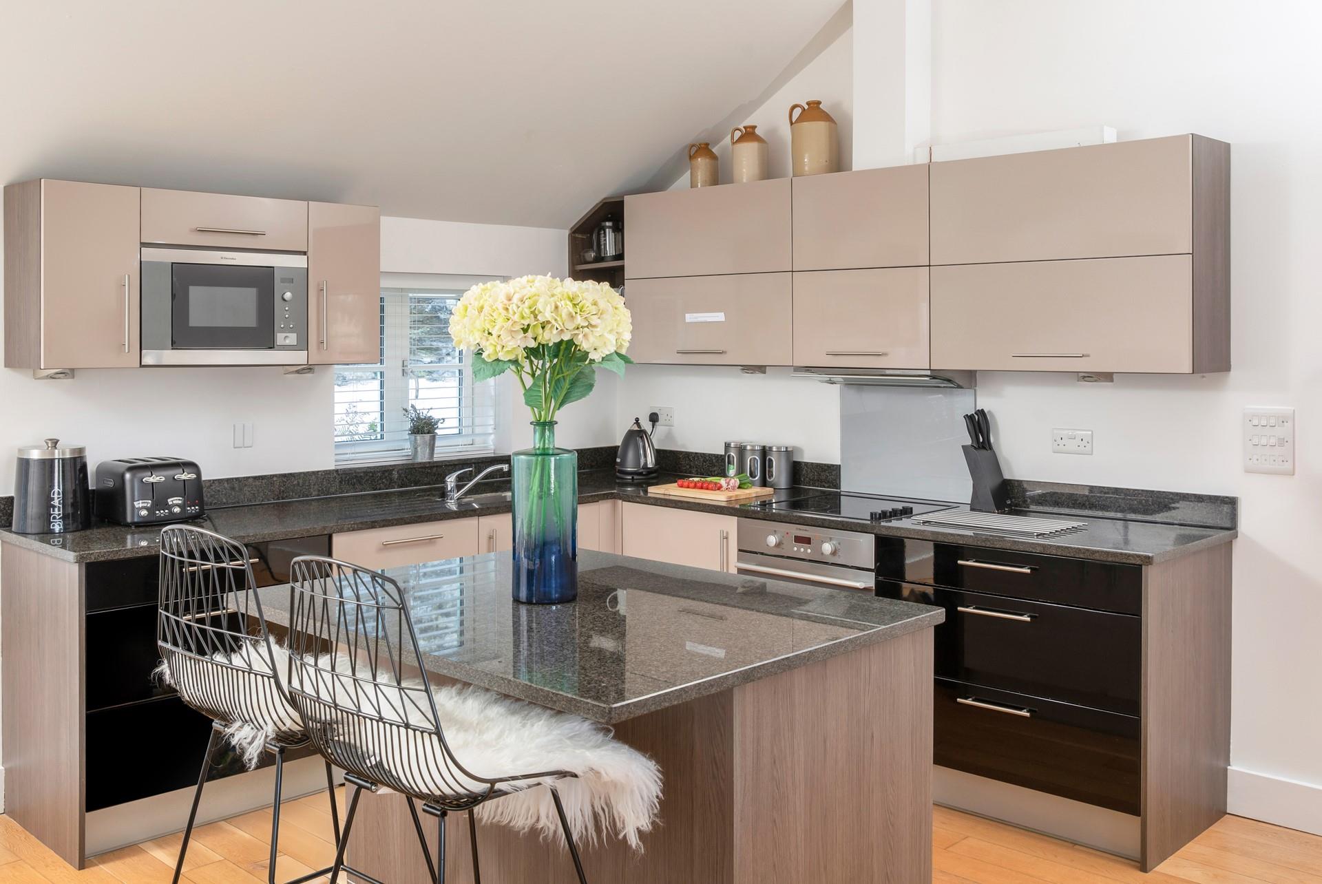 The kitchen is modern and fully equipped.