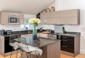 The kitchen is modern and fully equipped.