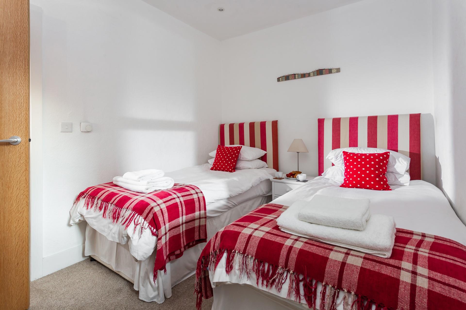 The bright and colourful twin room offers a peaceful night's slumber.