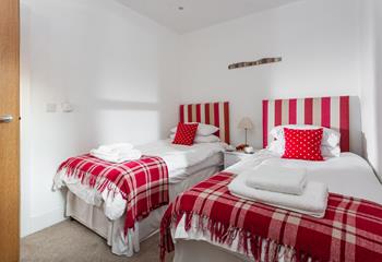 The bright and colourful twin room offers a peaceful night's slumber.