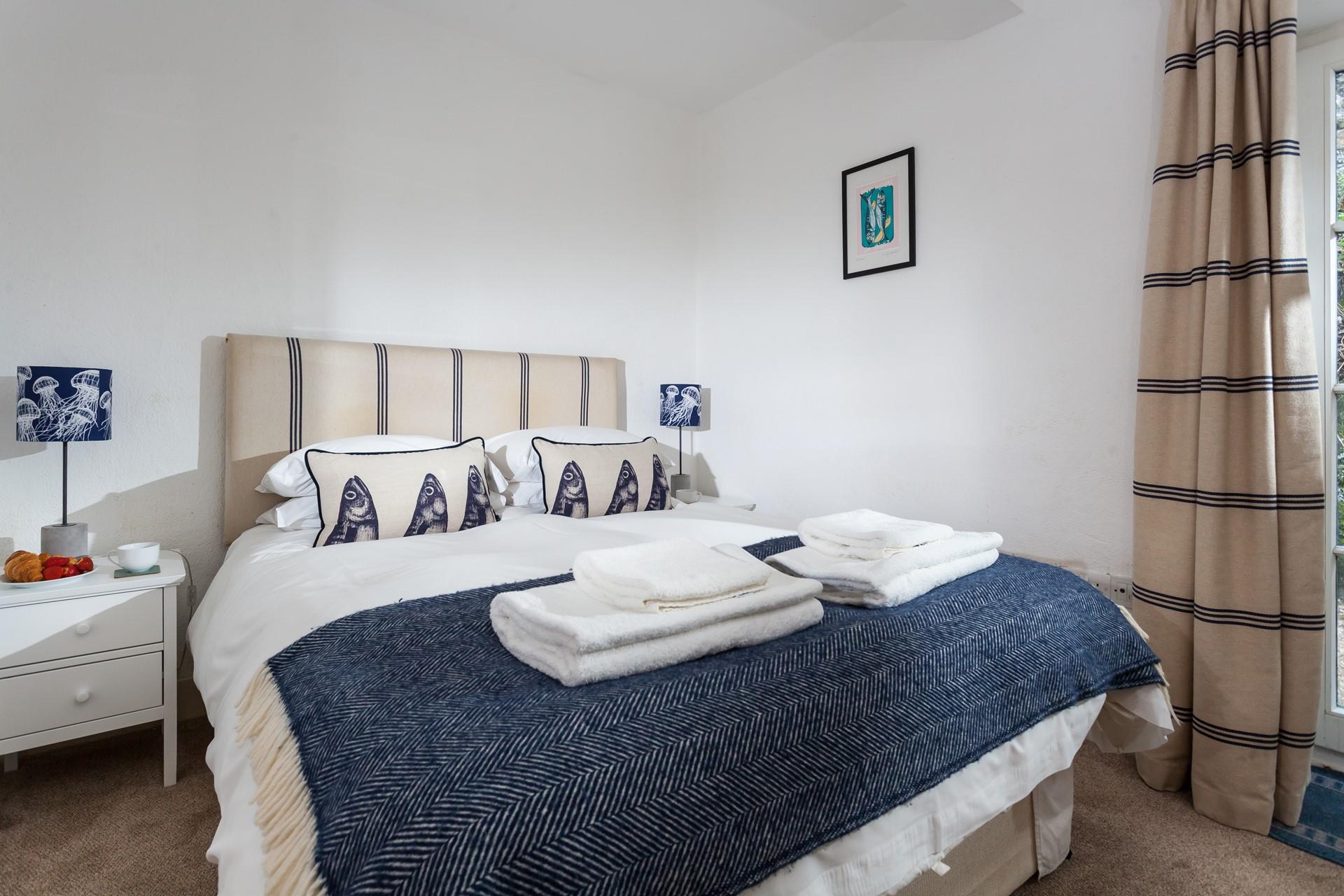 We love the fish cushions, in keeping with this lovely harbourside village.