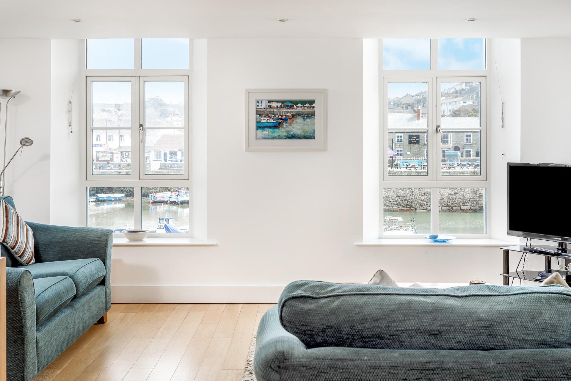The comfortable sofas are positioned to make the most of the wonderful views across the harbour.