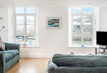 The comfortable sofas are positioned to make the most of the wonderful views across the harbour.