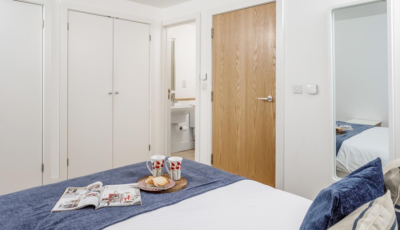 Bedroom 1 has a spacious king size bed and en suite with a shower.