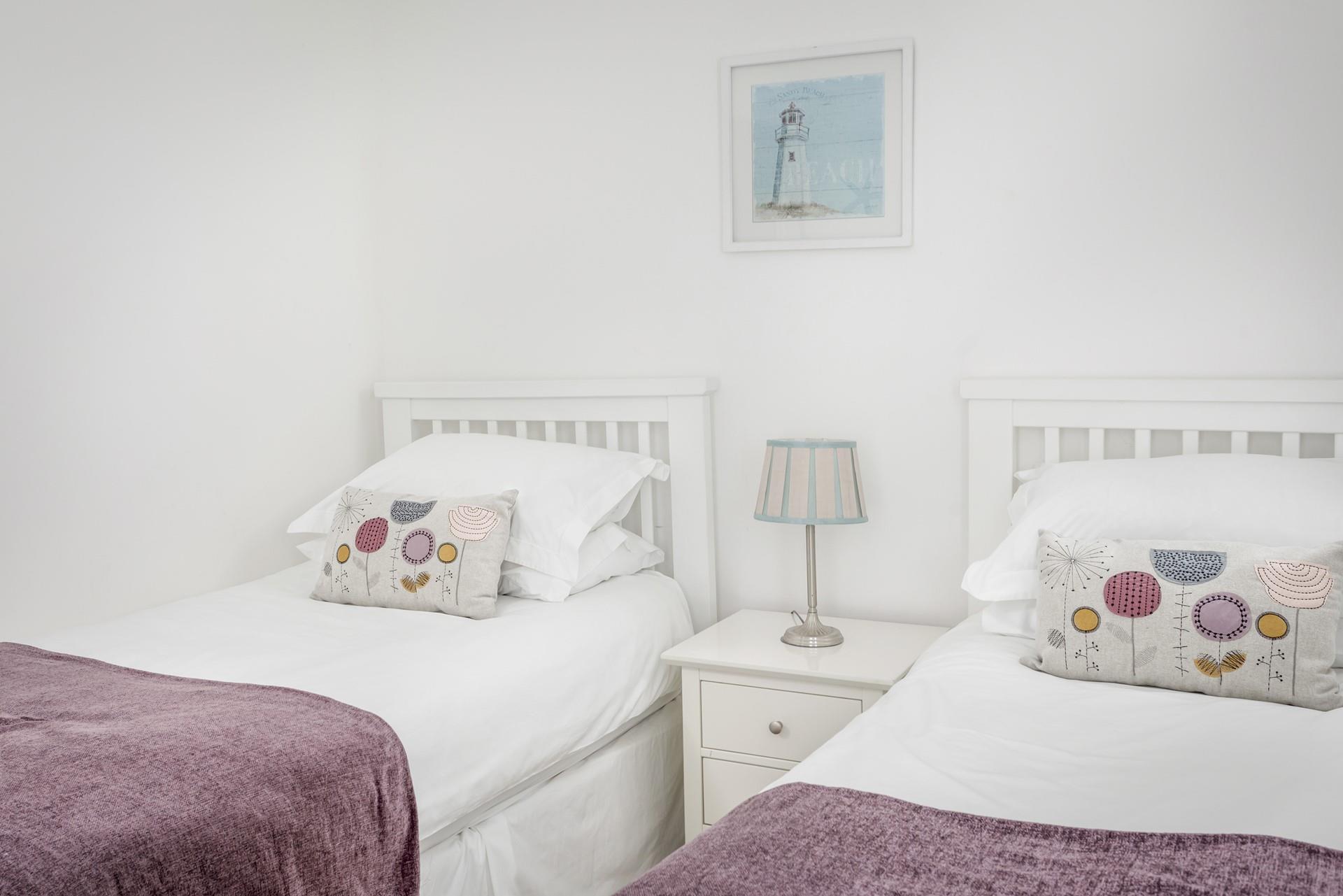 Bedroom 2 has cosy twin beds perfect for adults or children.