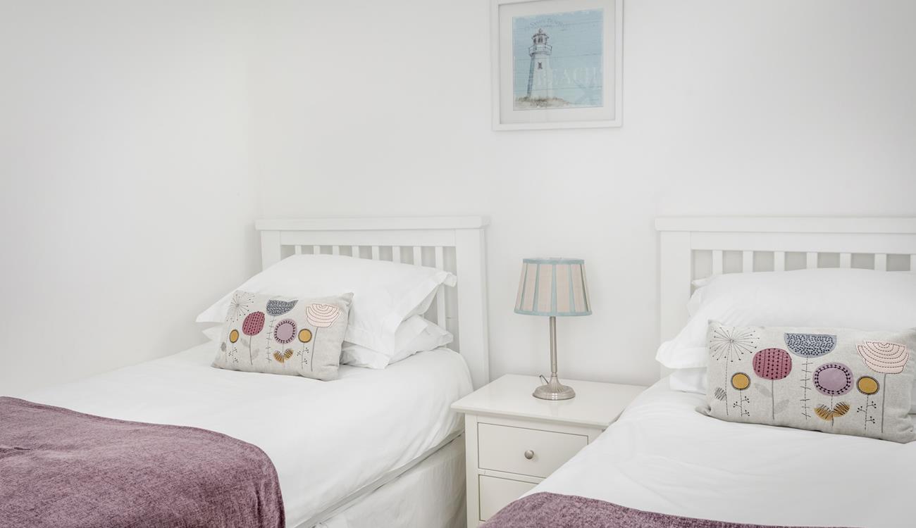 Bedroom 2 has cosy twin beds perfect for adults or children.