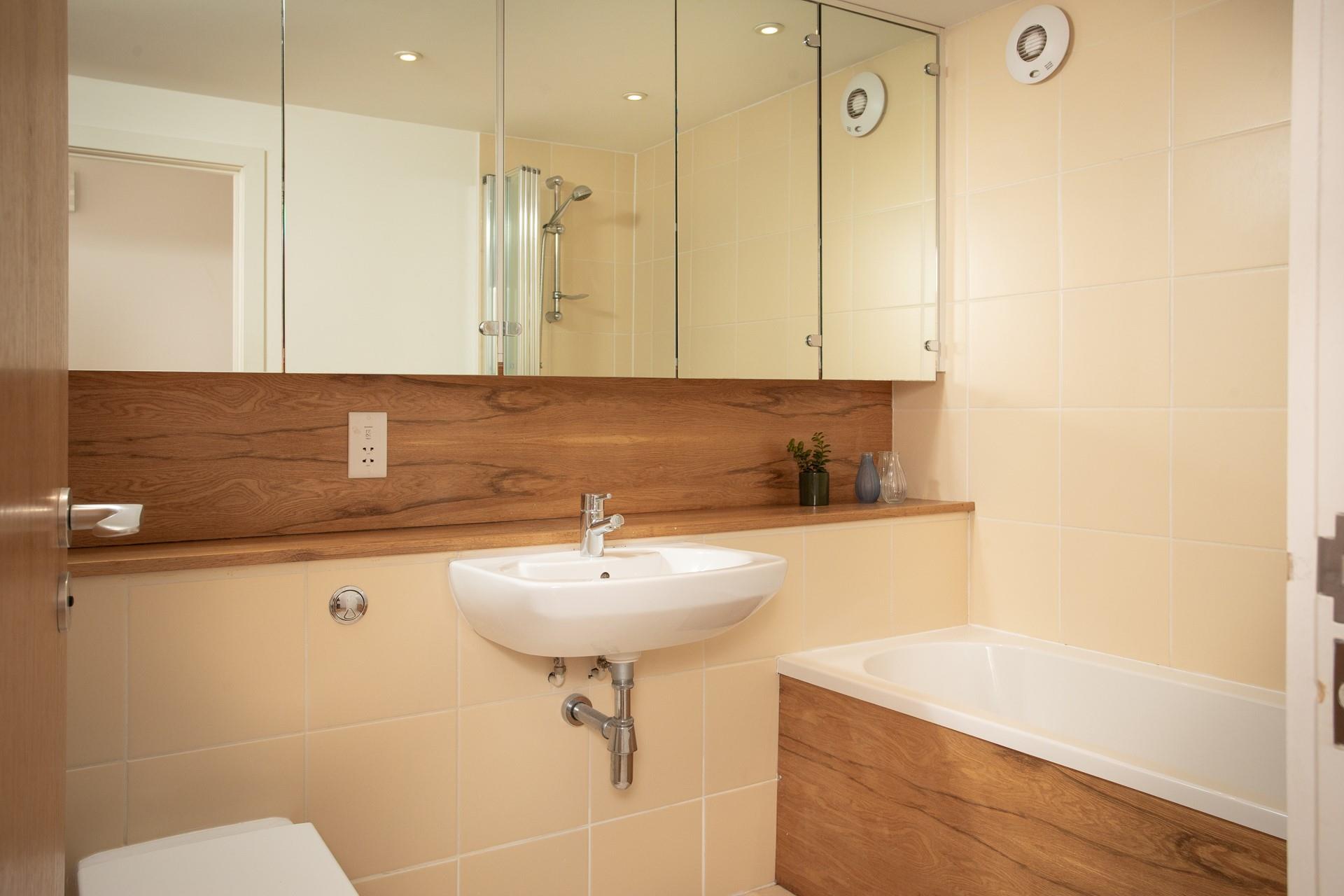 Get ready for the day in the spacious family bathroom.