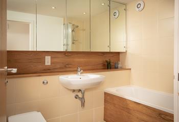 Get ready for the day in the spacious family bathroom.