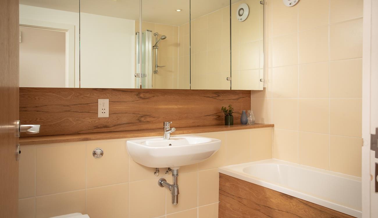 Get ready for the day in the spacious family bathroom.