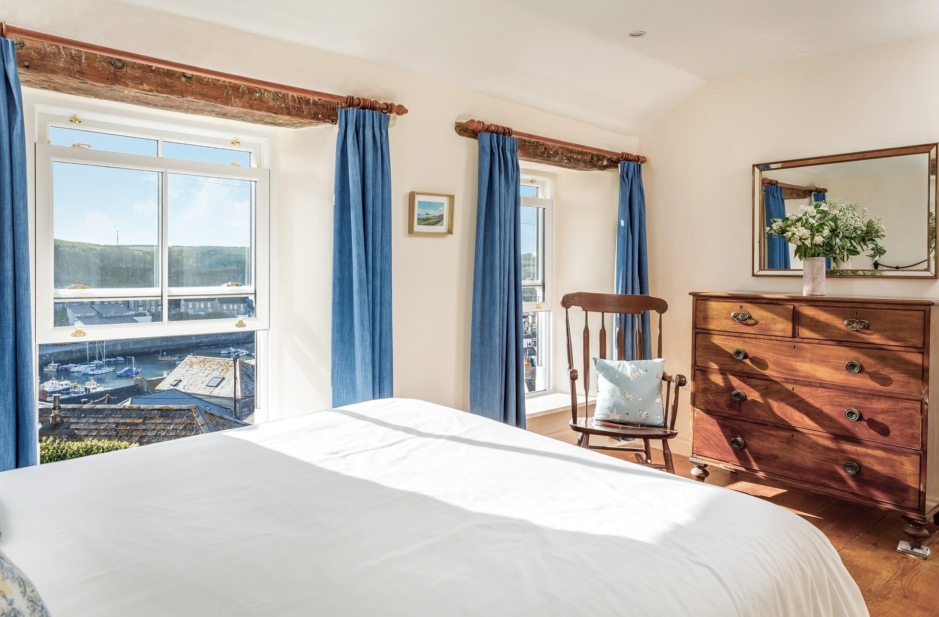 Bedroom 1 has stunning views across the harbour to enjoy at all times of the day.