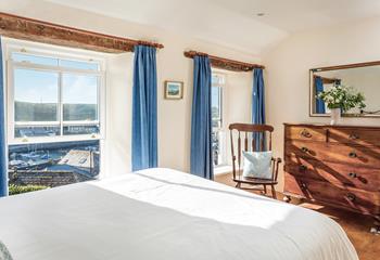 Bedroom 1 has stunning views across the harbour to enjoy at all times of the day.