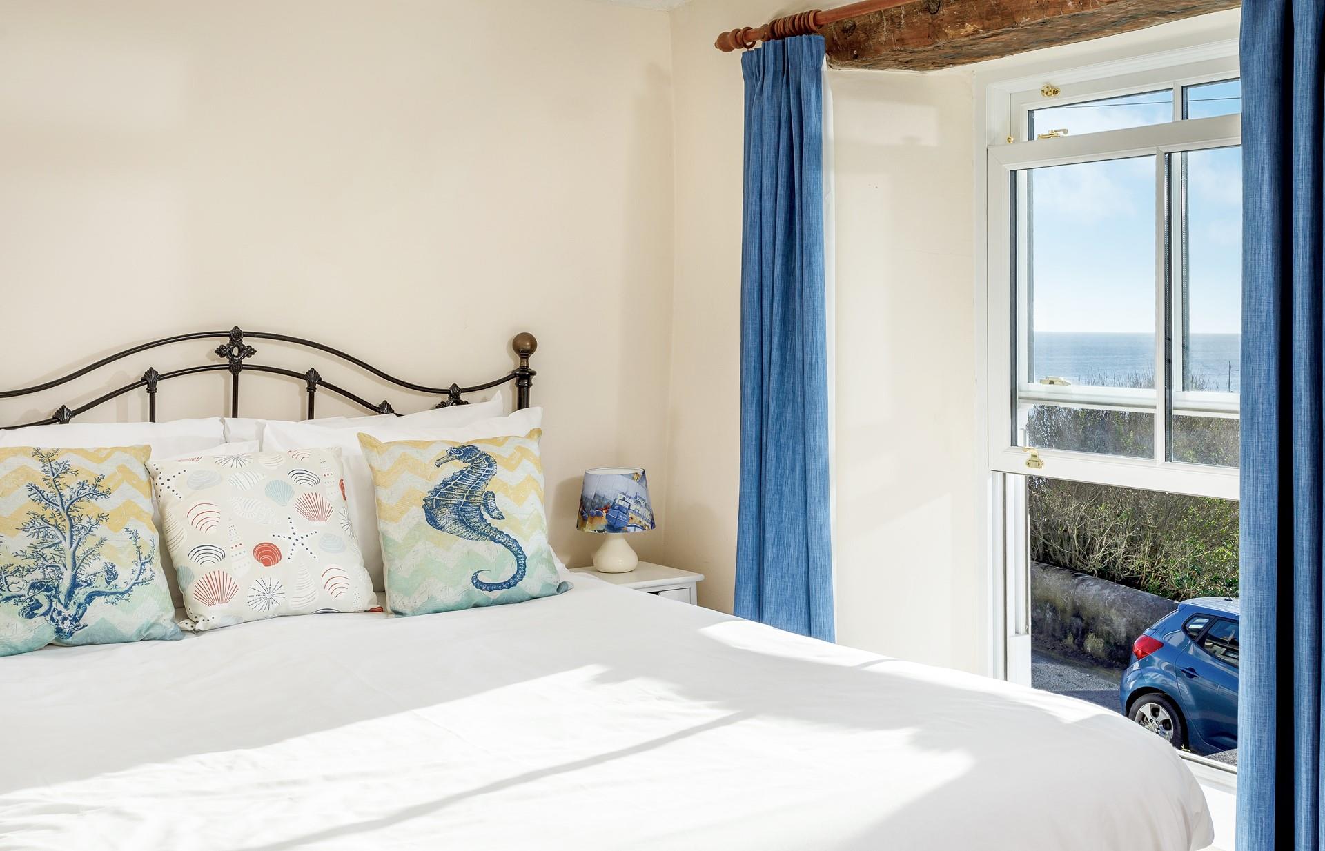 Seaside-inspired decor adds to the simple design of bedroom 1.