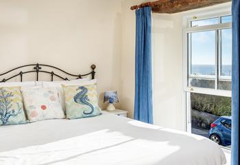 Seaside-inspired decor adds to the simple design of bedroom 1.