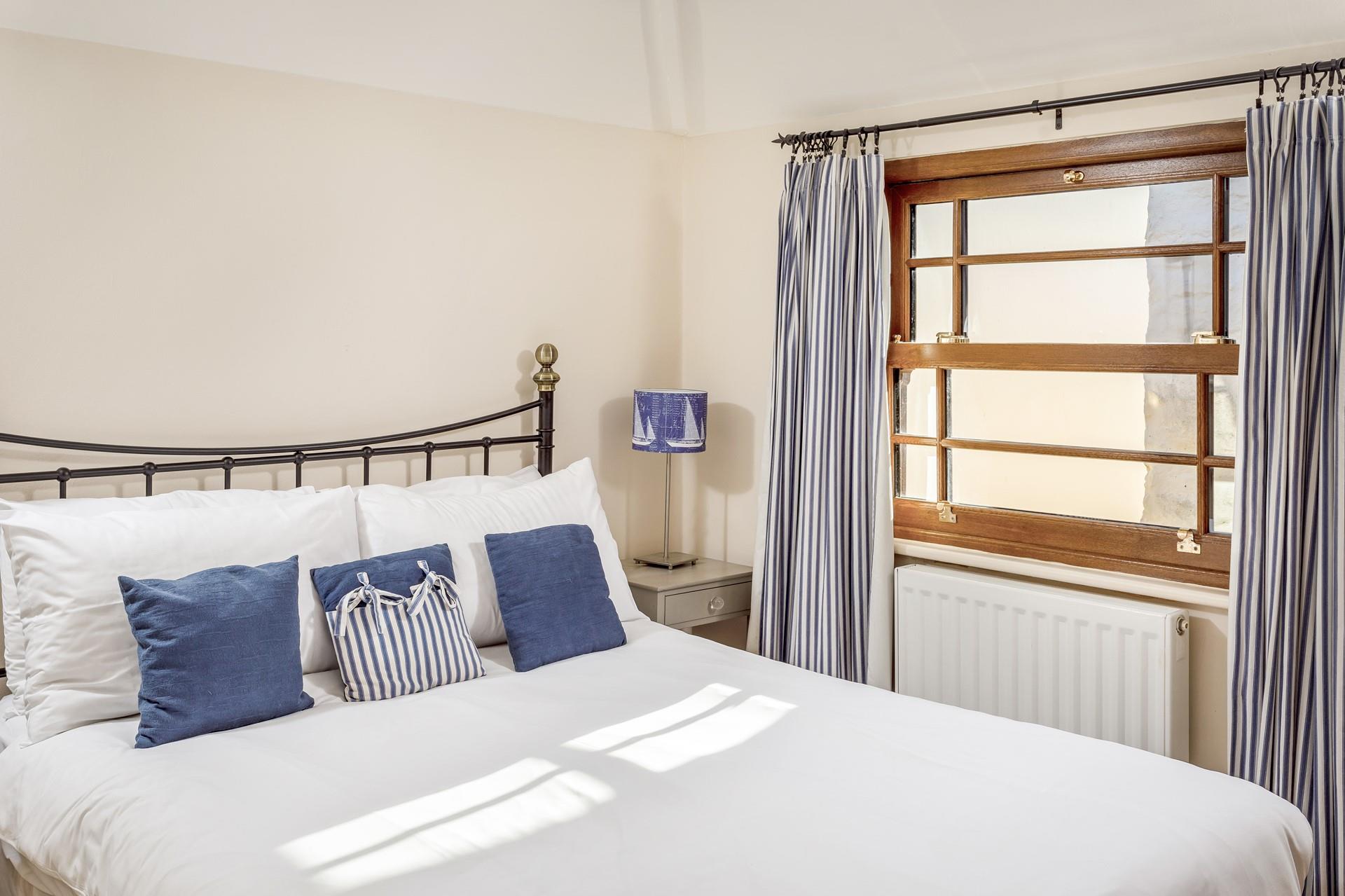 Bedroom 2 has a spacious double bed offering a peaceful night's sleep.