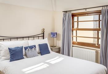 Bedroom 2 has a spacious double bed offering a peaceful night's sleep.