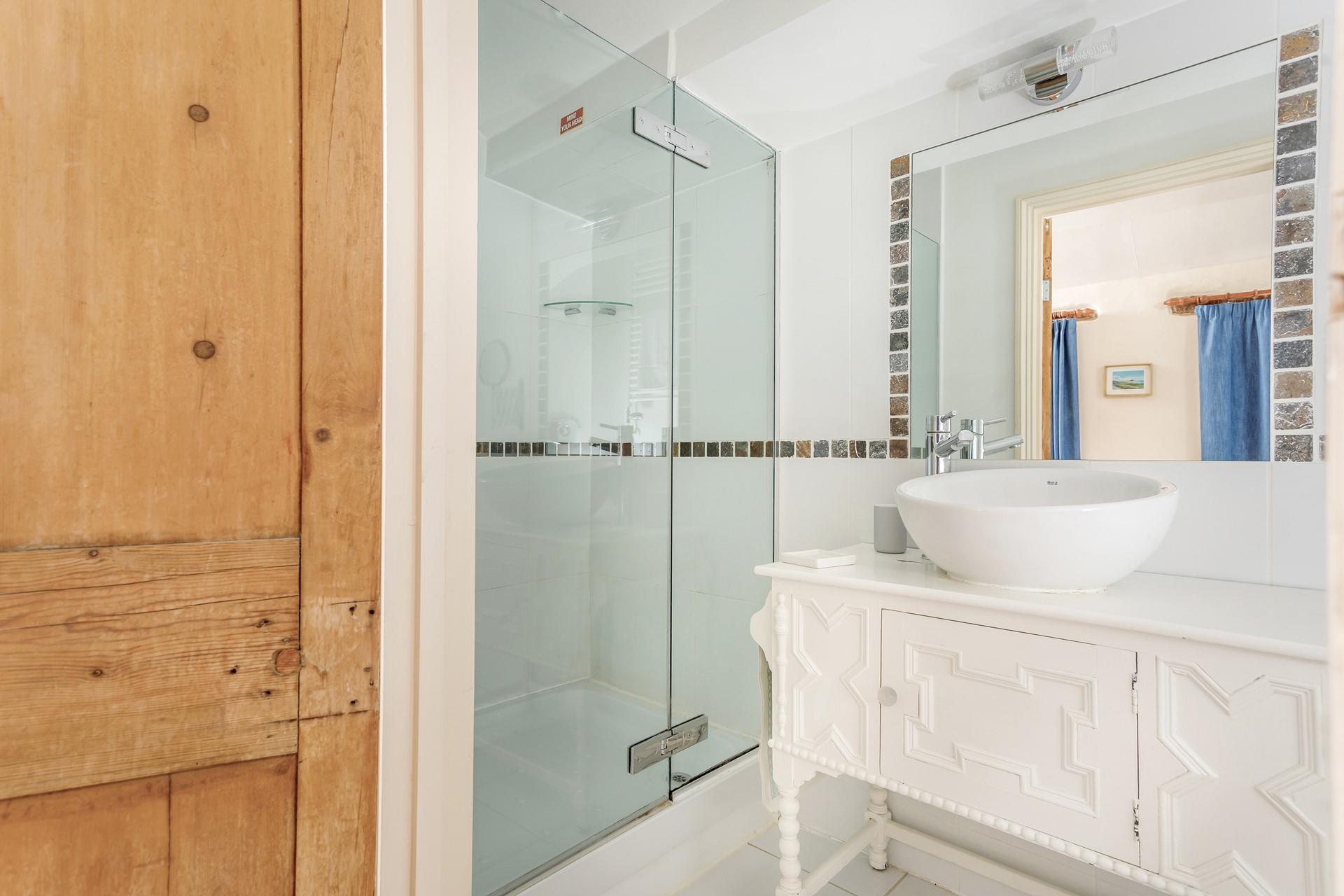 The en suite has a large shower for washing the day away.