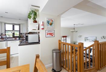 The kitchen and dining area is up the stairs from the cosy sitting room.