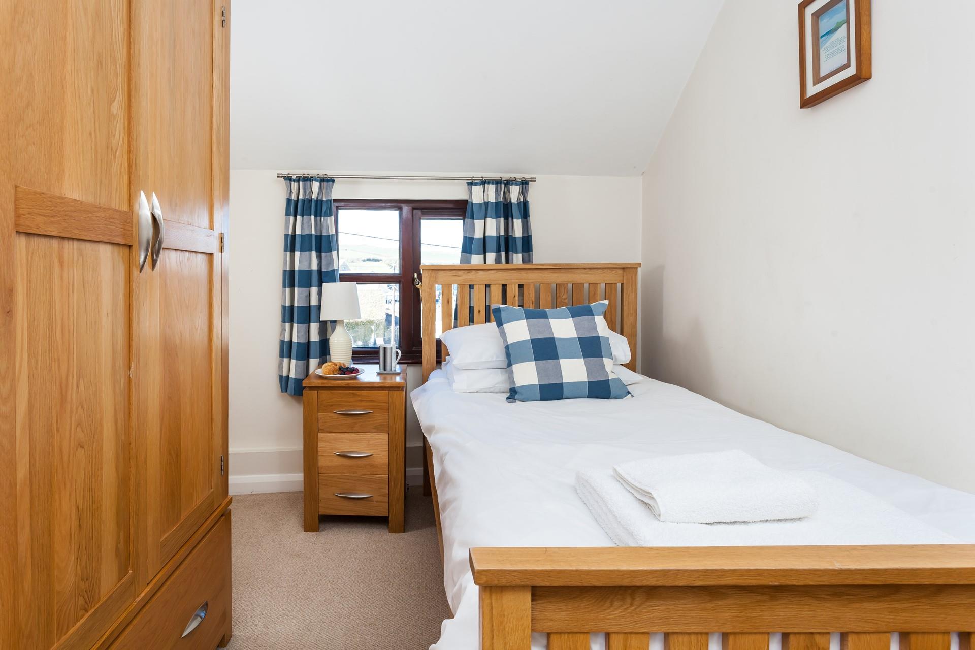 Bedroom 2 has twin beds for the younger ones in the family.