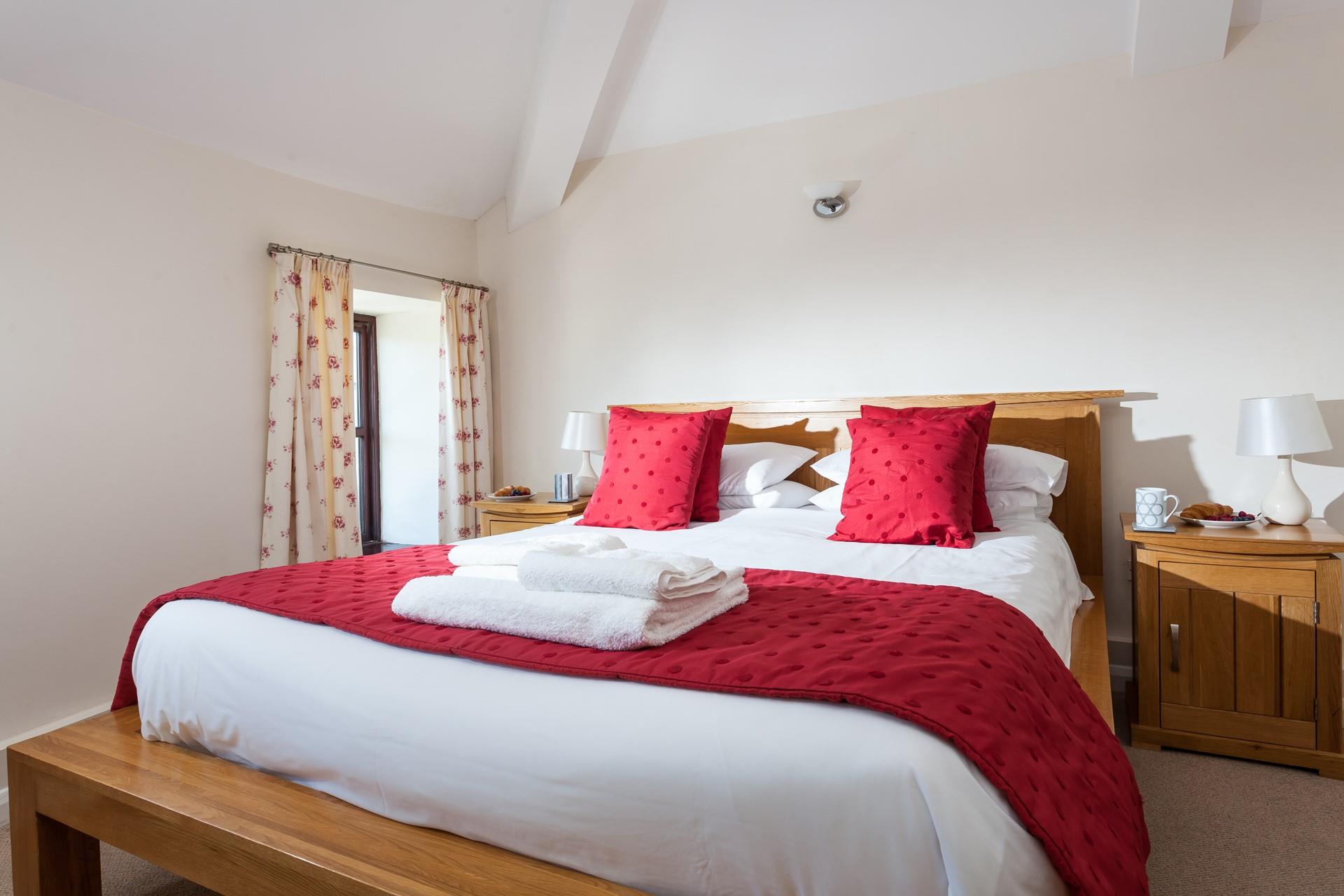 Bedroom 1 has a spacious king size bed for a relaxing night's slumber.