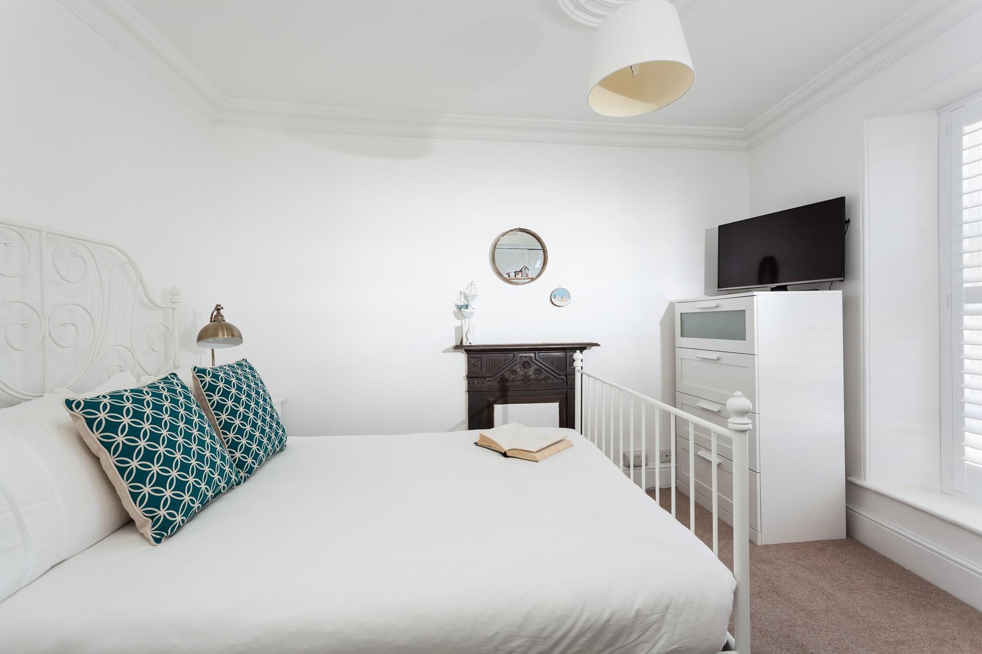 Bedroom 1 has a double bed to sink into for a restful night's sleep.