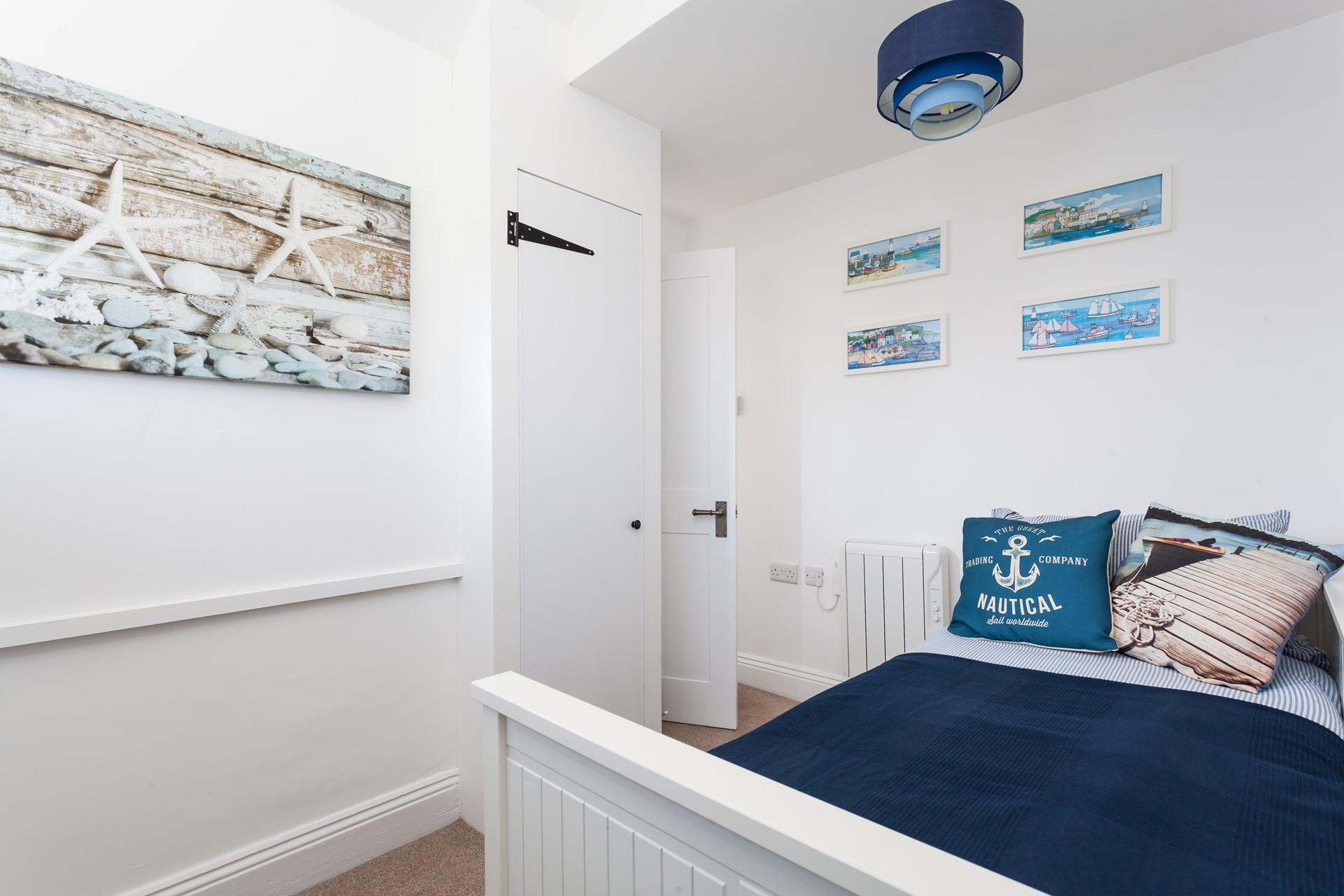 A nautical theme runs through the cosy cottage.