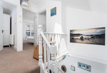 Cornish coastal scenes fill the walls of this lovely cottage.