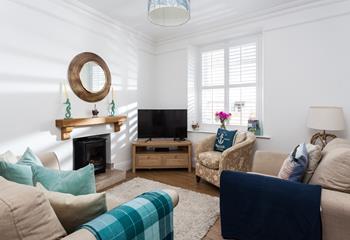 Bright beachy blues in the cosy sitting room create a calming space to relax.