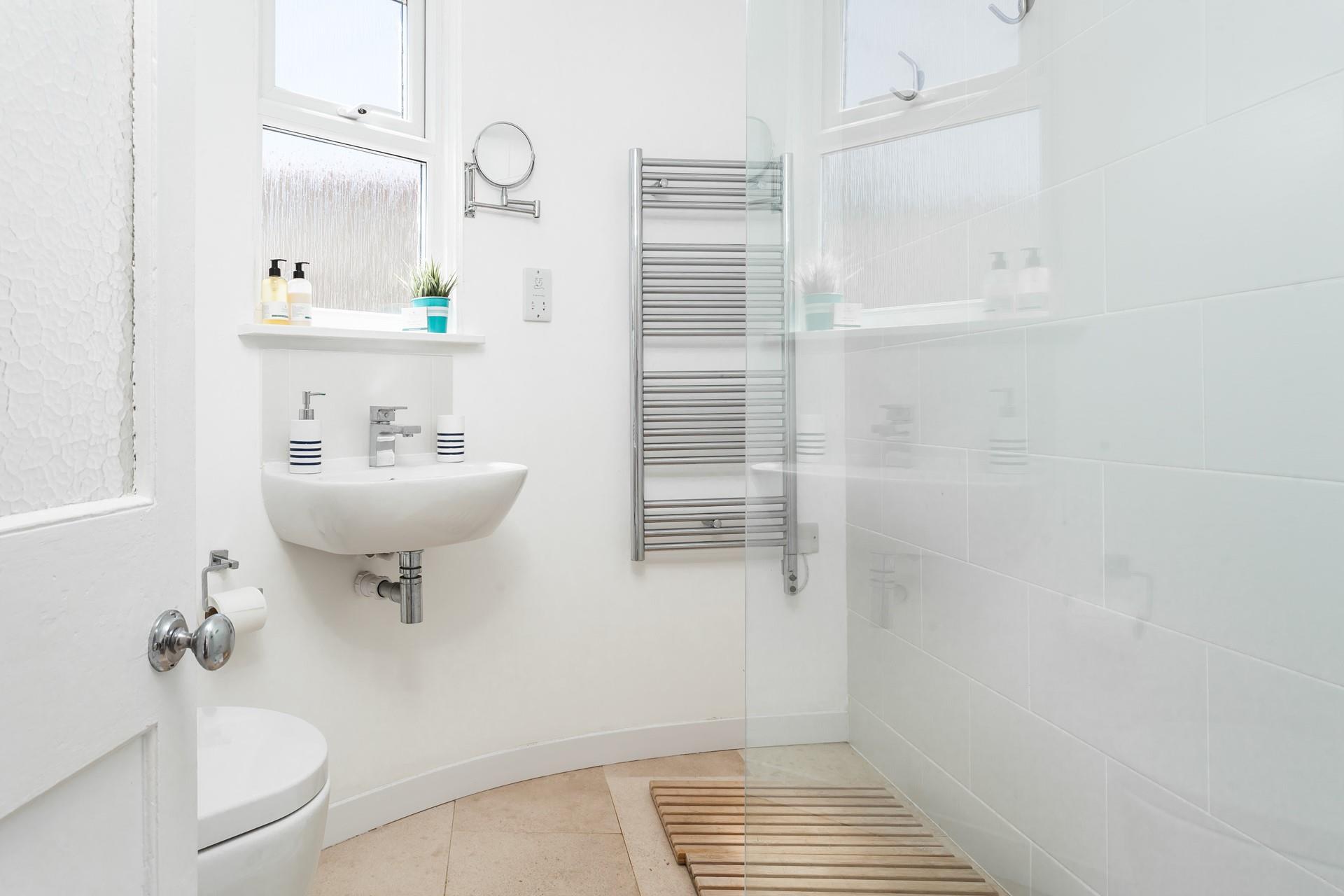 Wash off sandy toes in the shower room after beach days.