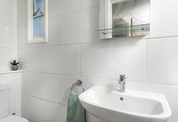 The bathroom is modern and the perfect space to get ready in the morning.