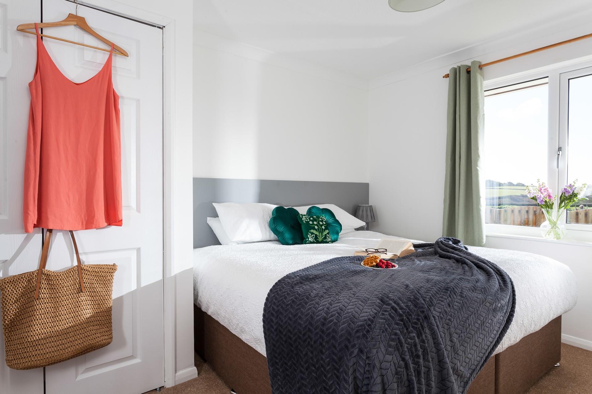 The spacious king size bed offers a dreamy night's sleep.