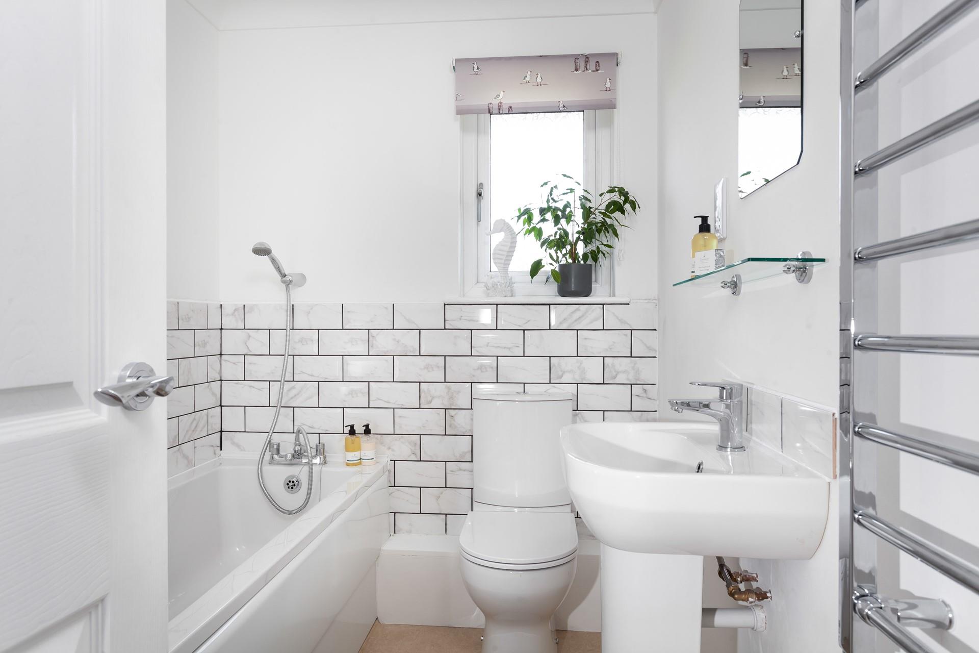 Run yourself a bubble bath in the stylish bathroom to relax and unwind.