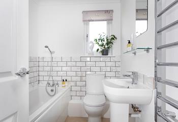 Run yourself a bubble bath in the stylish bathroom to relax and unwind.