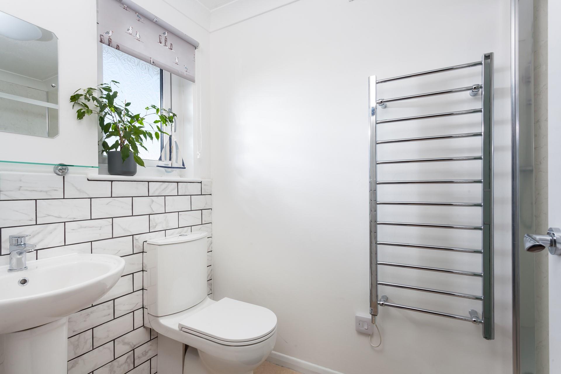 Warm fluffy towels can be used straight from the rail after a morning shower.