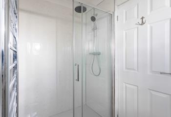 Wash off those sandy toes in this large walk-in shower room. 