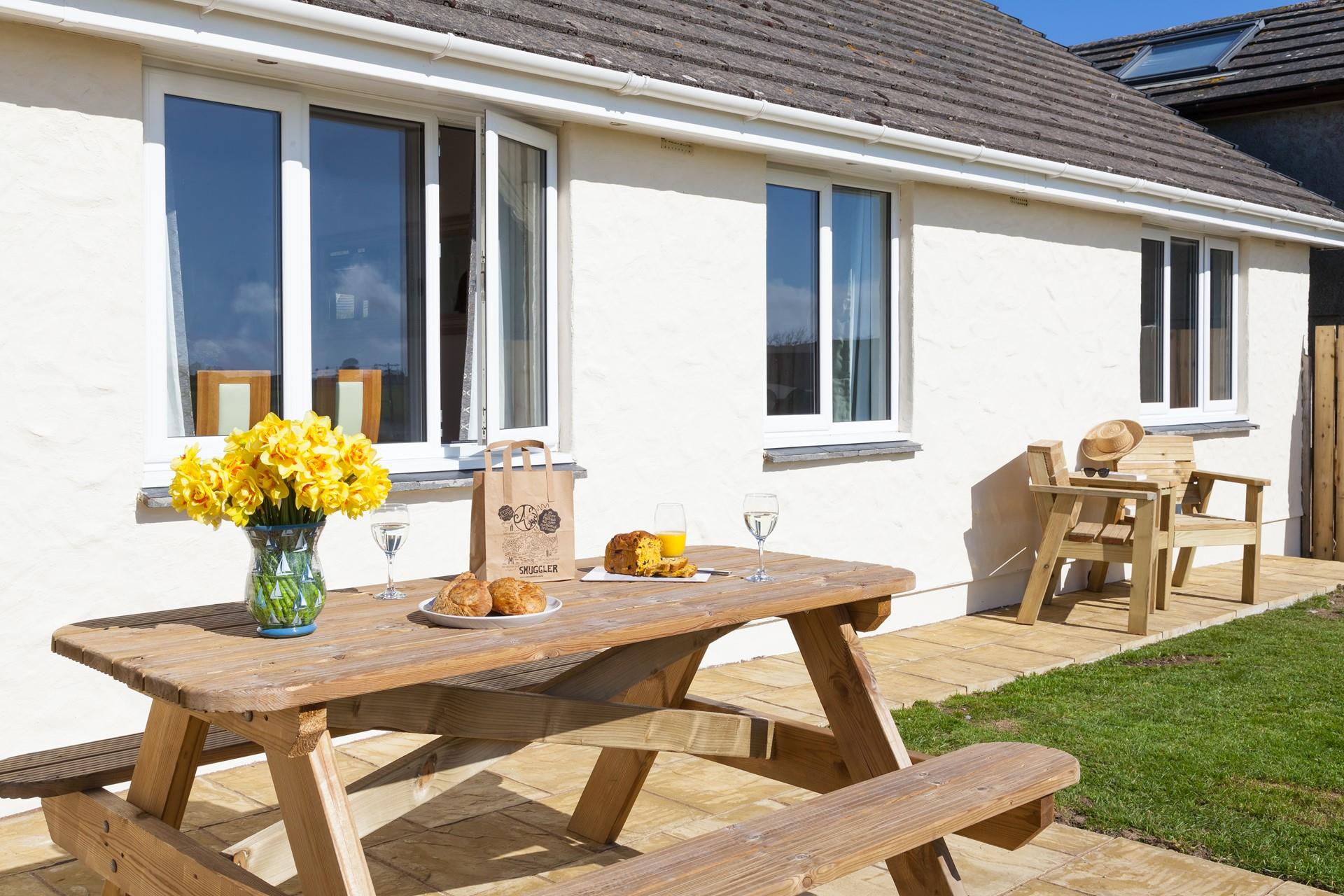 Watch the kids and furry friends play in the large enclosed garden.