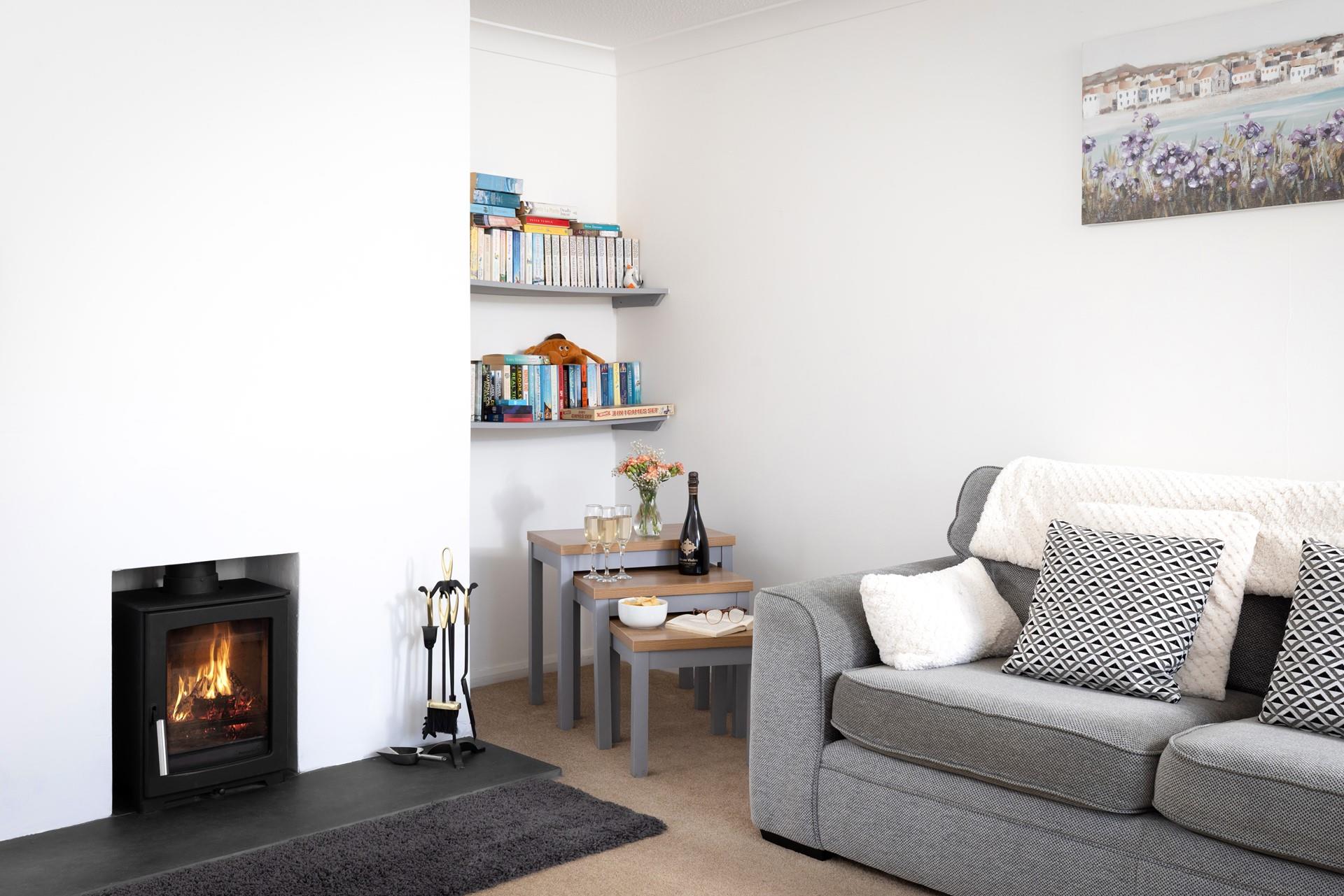 Snuggle up, glass in hand, in front of the fire. 