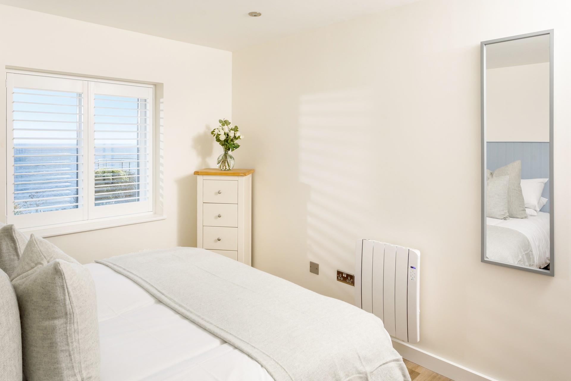 The stylish bedroom is a haven for relaxation.