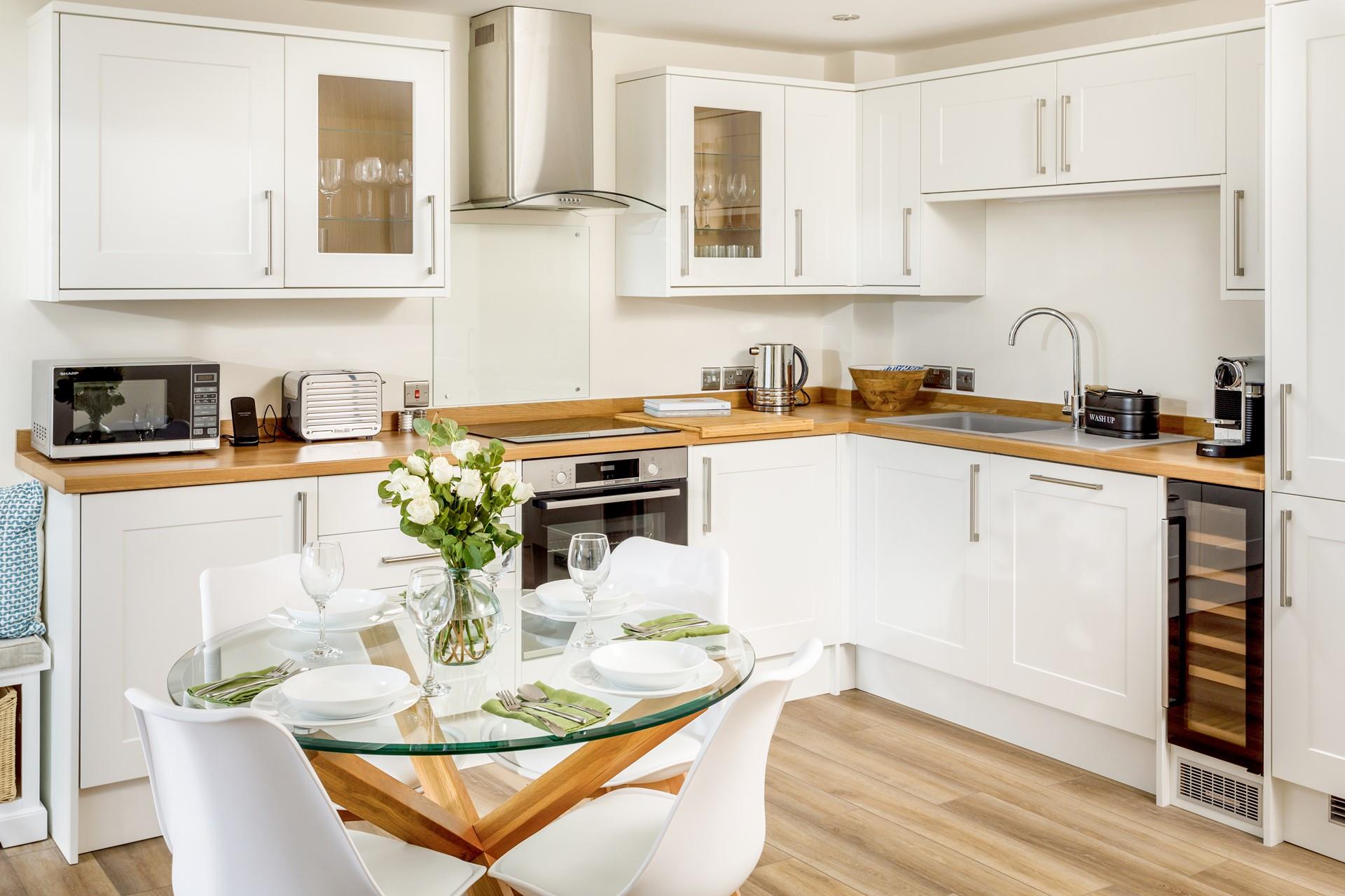 The stylish and modern kitchen is perfectly equipped for cooking up a storm.