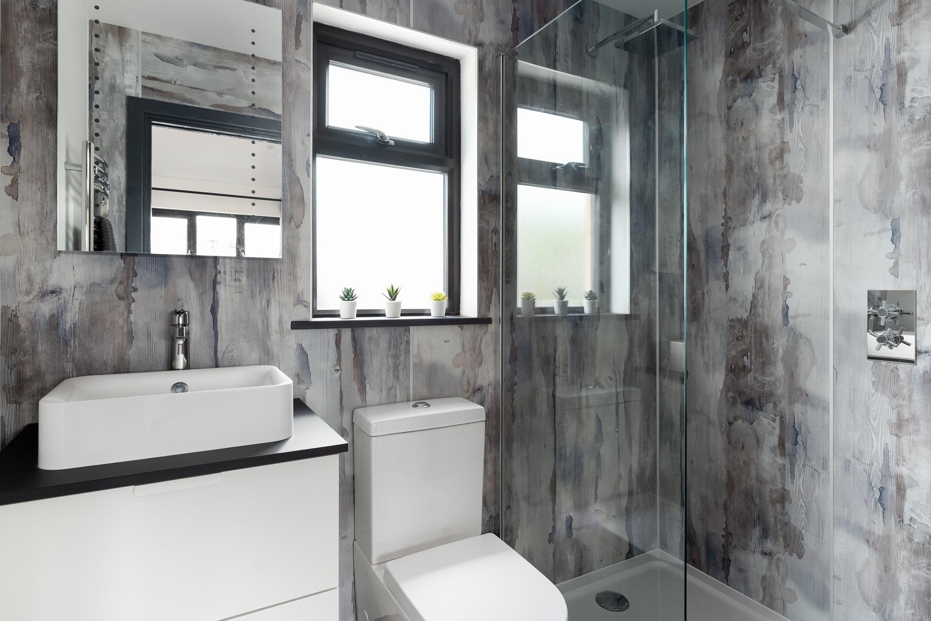 The en suite shower room is modern and perfect for washing off sandy toes.