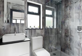 The en suite shower room is modern and perfect for washing off sandy toes.